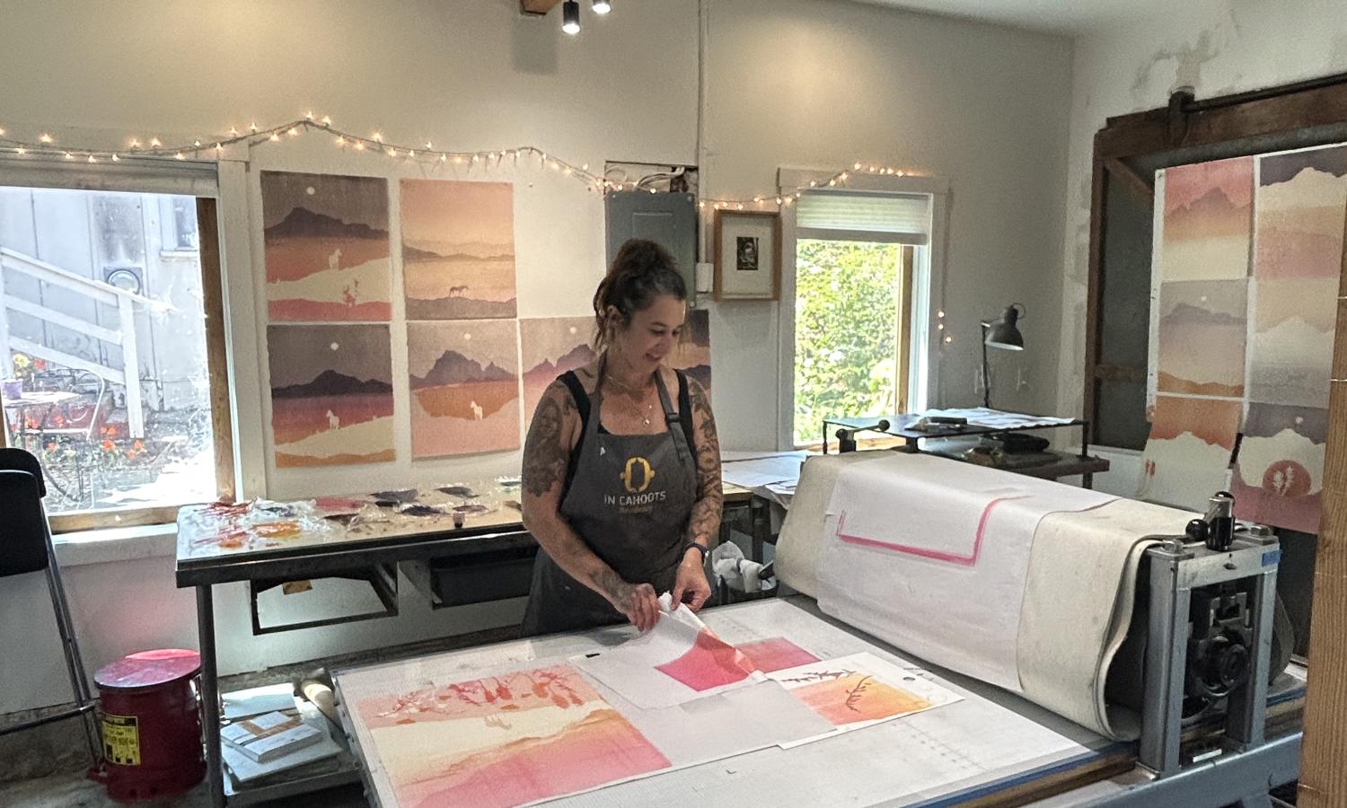 Artist working on Takach press