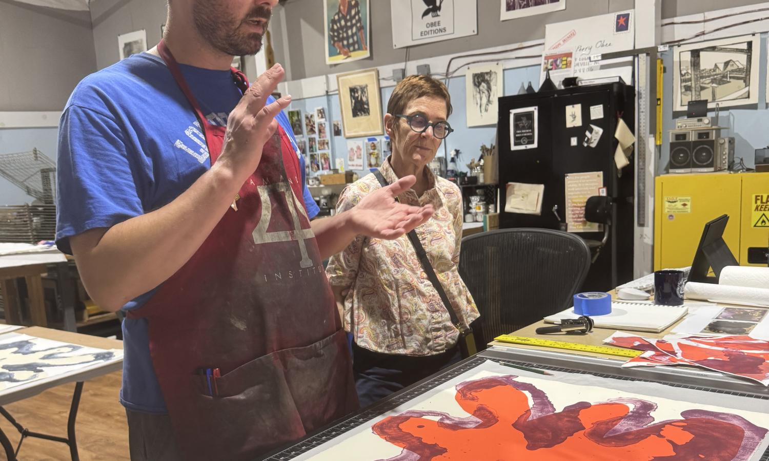 Resident artist, Elisabeth Condon, discussing a project with Master Printer, Perry Obee