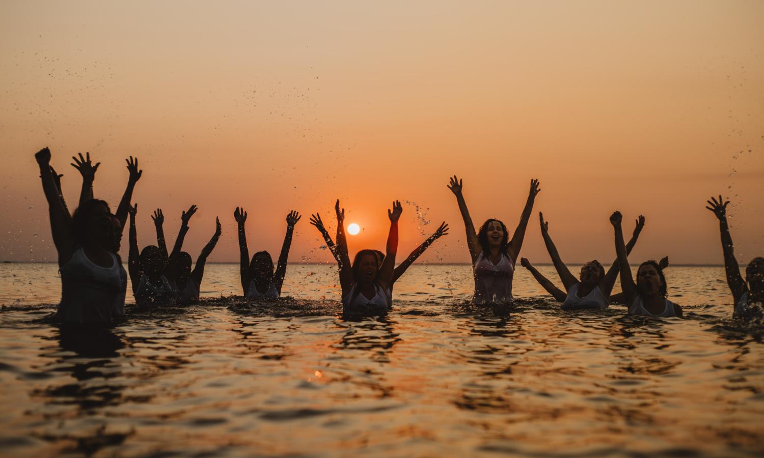 artists swimming in river