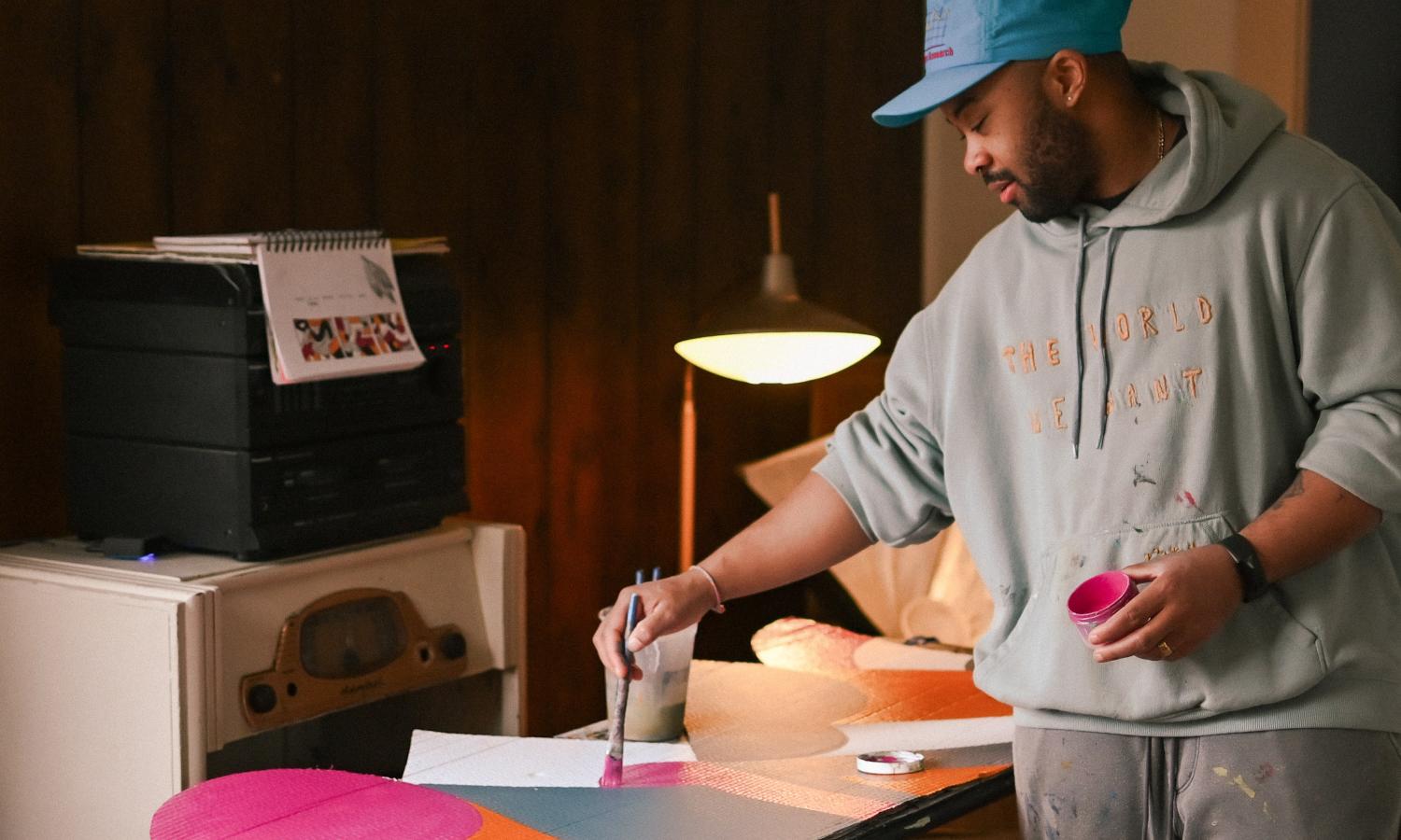artist in residency painting in historic cabin