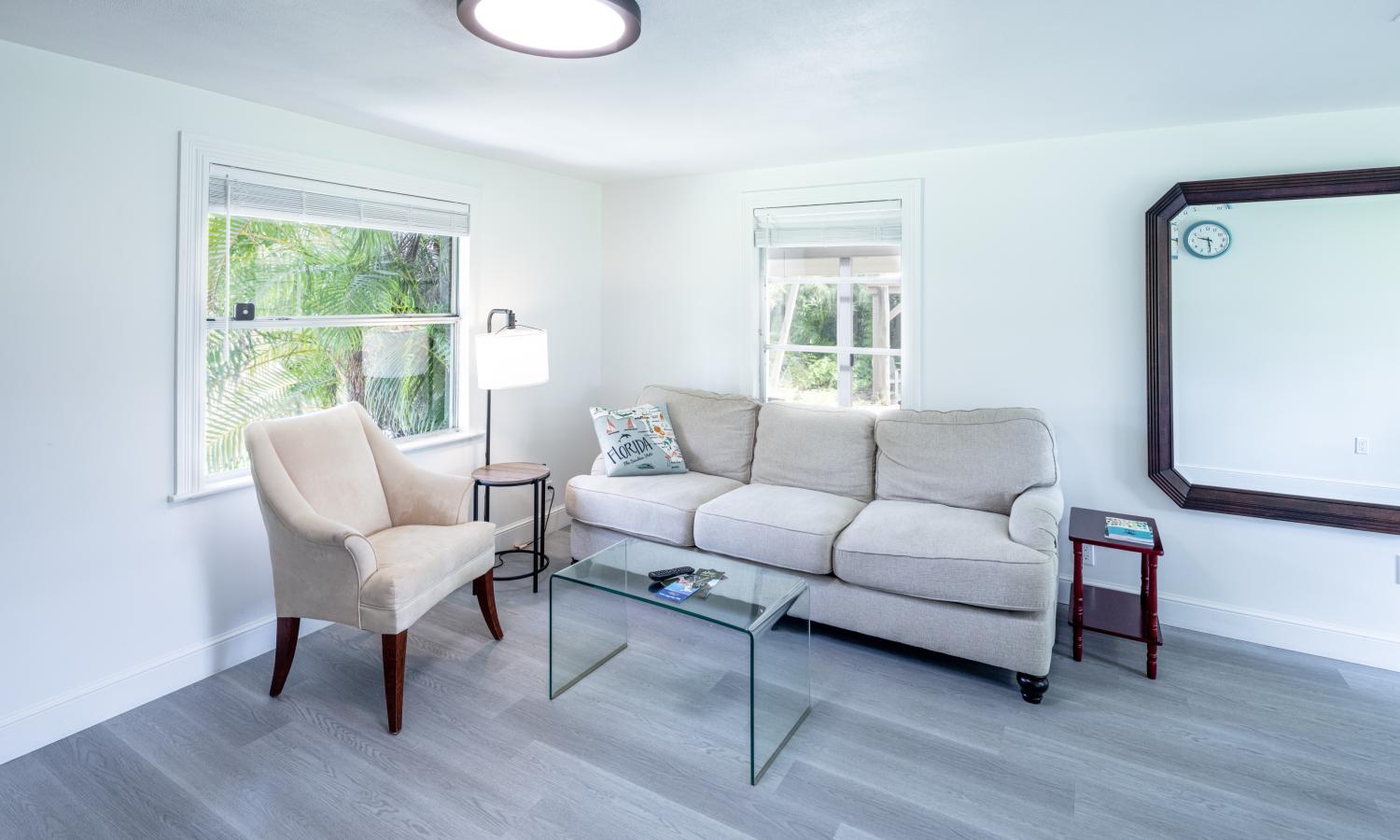 Cozy living room with a sofa, accent chair, and coffee table.