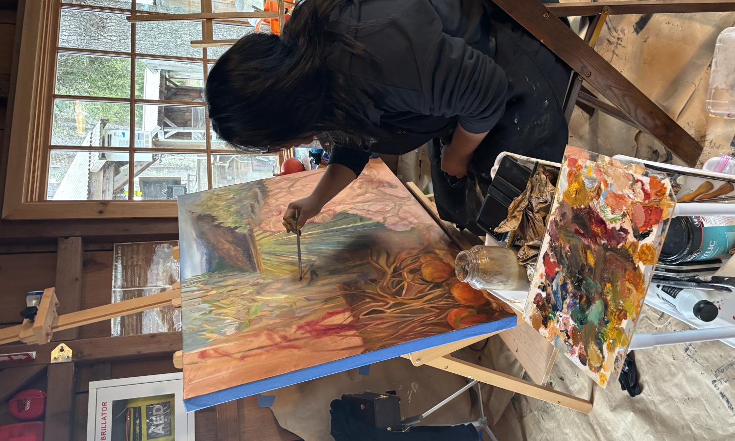 Paola painting in the studio