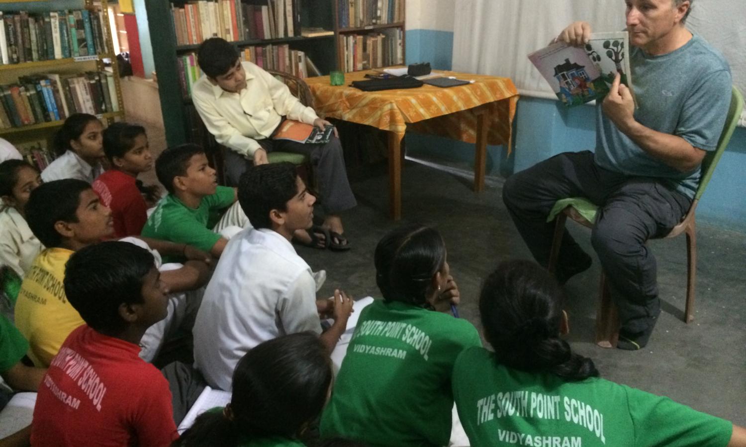 Children's illustrator and writer presenting to a group of NIRMAN students