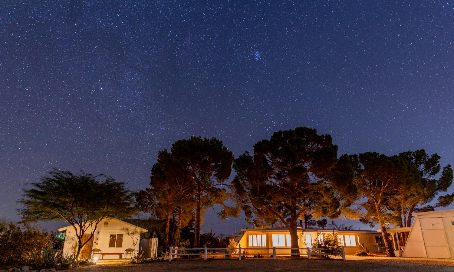 Wide view of Jackrabbit Studios campus under starry night sky