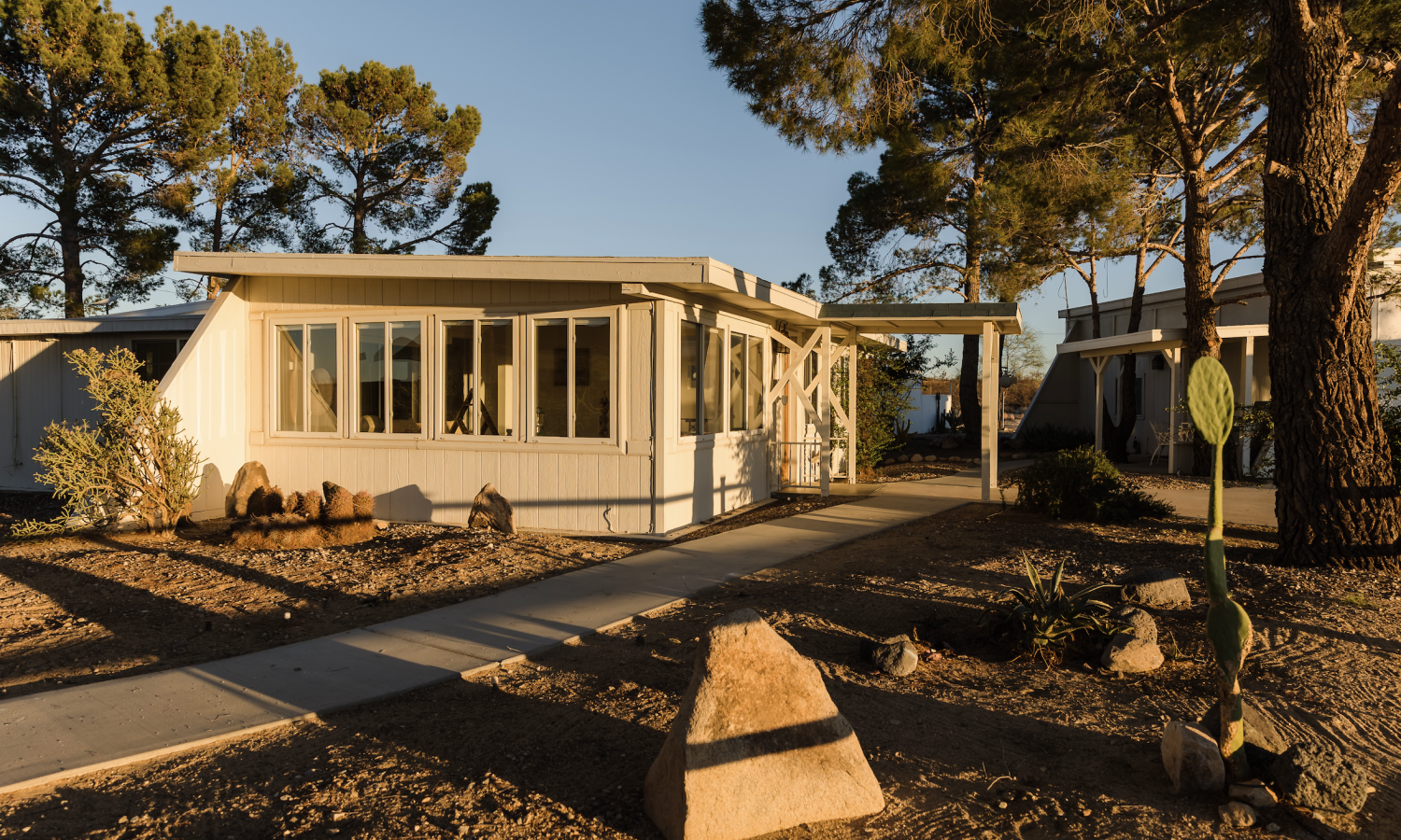 View of the main house under mature pines