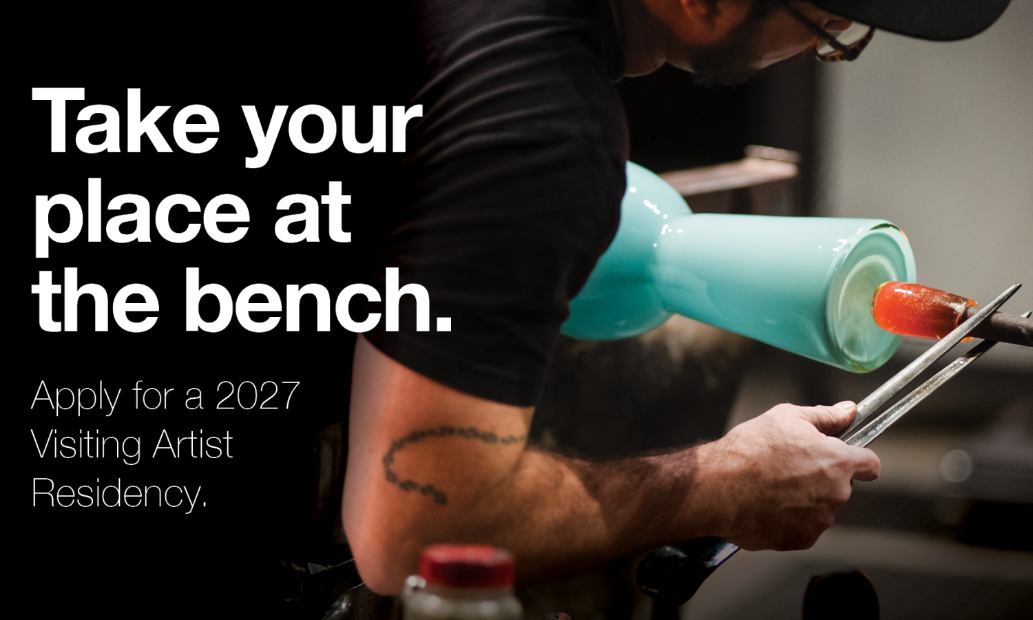 Glassblowing image with text on screen "Take your place at the bench. Apply for a 2027 Visiting Artist Residency."