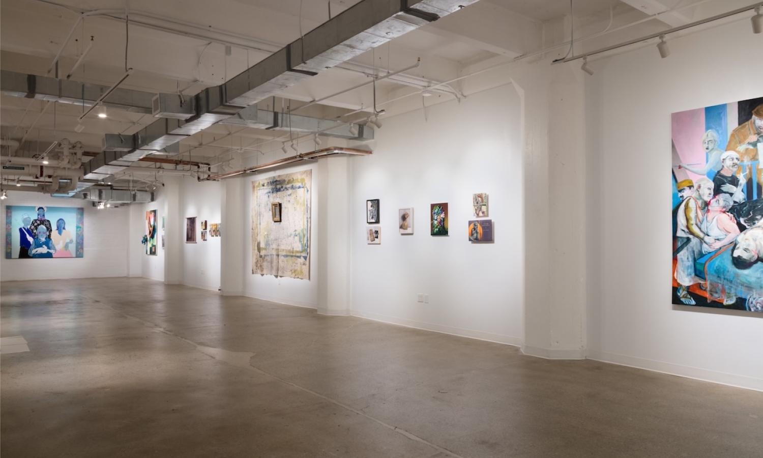 image of right side of 4000 sq ft Gallery 14C with paintings hung on walls